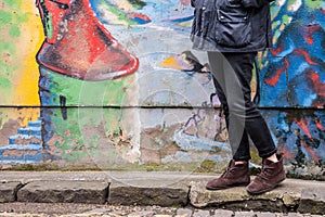 Model wearing skinny trousers and brown boots