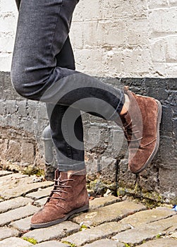 Model wearing skinny trousers and brown boots