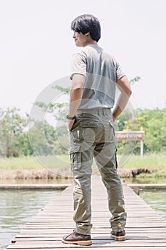 Model wearing sofe green color cargo pants or cargo trousers