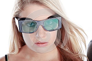 Model woman looks with safety goggles