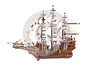 Model of wood sailboat ship isolated on white. Wooden ship model isolated