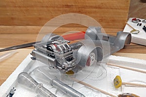 Modeling.  Build a scale model of the car. The engine with exhaust, gearbox and suspension are painted with an airbrush and