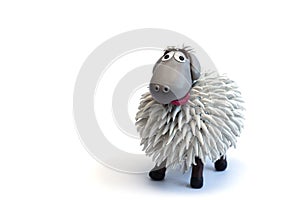 Modeling clay sheep on white background