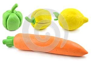 Modelling clay carrot, bell pepper and lemon photo