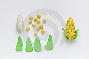 Modelling clay. Craft Plasticine Corn vegetable. Step by step. Children art lesson and plasticine concept.