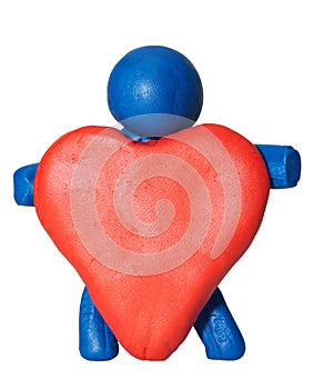 Modelling clay man holding heart