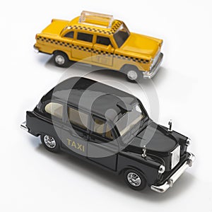 models of black london and yellow new york taxis