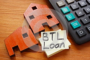 Models of home and BTL loan sign or buy to let.