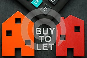 Models of house, calculator and inscription Buy to let BTL.