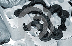 Models printed on 3D printer. Black objects printed on 3D printer made plastic