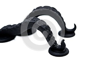 Models printed on 3D printer. Black objects printed on 3D printer made plastic