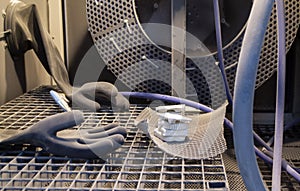 Model printed 3D printer from white polyamide powder inside shotblasting machine