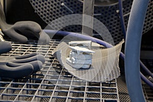 Model printed 3D printer from white polyamide powder inside shotblasting machine