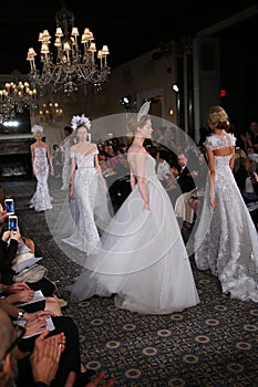 Models walk the runway at the Mira Zwillinger Spring 2015 Bridal collection show