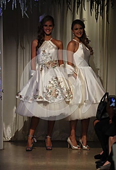 Models walk the runway wearing Matthew Christopher dresses at NY Bridal Fashion Week