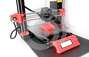 Modern 3D printer printing a plastic object. Motion blur