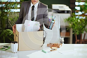 Modern 40 years old woman worker in green office