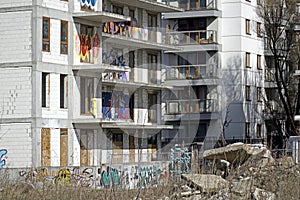 Modern and abandoned residential building covered with graffiti
