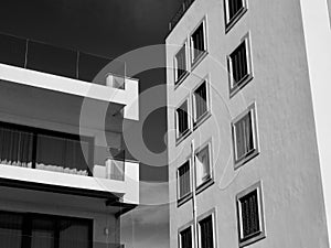 Modern Abstract architecture images, in black and white, small building with windows and balconies
