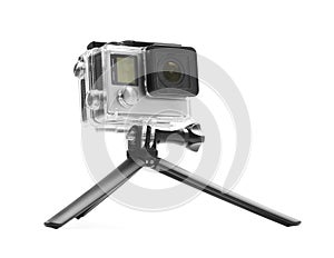 Modern action camera and tripod isolated on white
