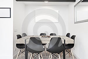Modern aesthetic dining table with eight chairs for diners photo