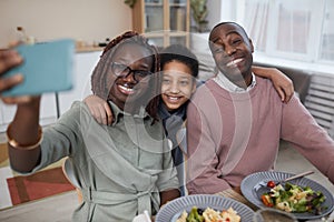 Modern African American Family Taking SElfie at Dinner Table