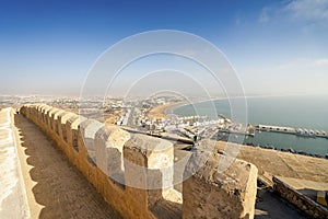Modern Agadir with wide beach and port seen from old city walls on Oufella Hill, Morocco