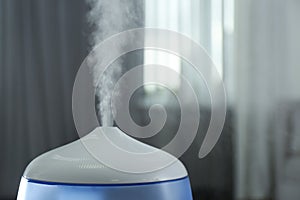 Modern air humidifier, closeup. Space for text