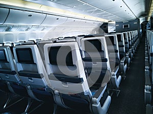 Modern aircraft interior with seats and blank touch entertainment