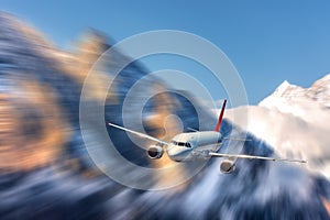 Modern airplane mith motion blur effect at sunny bright day. Lan