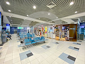 Modern airport waiting hall with duty free shop