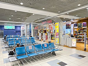 Modern airport waiting hall with duty free shop