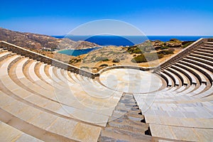 Modern amphitheater overlooking the Aegean Sea and Milopotas beach on Cyclades Island of Ios.