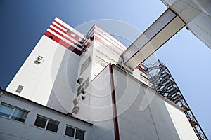 Modern animal feed factory. Agro-industry building in sunny day