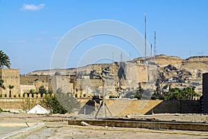 Modern antennas on a mound of sandstone desert,