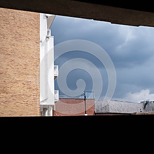 Modern Apartment Block Exterior Against A Grey Cloudy Sky With No People