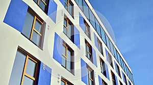 Modern apartment building with colorful facade.