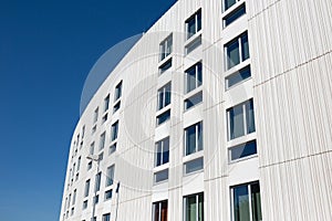 Modern apartment building with decorative grooved concrete facade