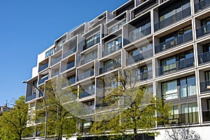 Modern apartment building with floor-to-ceiling windows