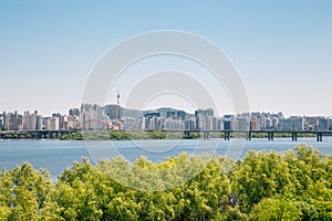 Modern apartment buildings and Han river park in Seoul, Korea photo