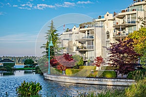 Modern apartment buildings with nice pond BC Canada. Residential district, ornamental pool of modern apartment complex