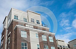 Modern apartment buildings on a sunny day with a blue sky. Facade of a modern apartment building. New apartment building