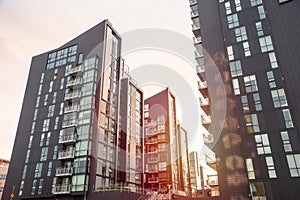 Modern apartment buildings at sunset