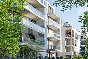 Modern apartment buildings surrounded by greens