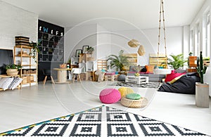 Modern apartment with colorful poufs photo