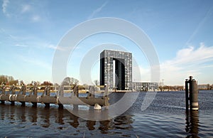 Modern apartments building and mooring posts