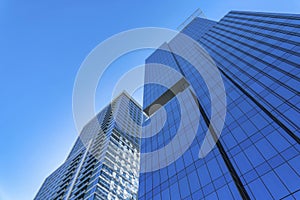 Modern apartments towering against blue sky background on a sunny day