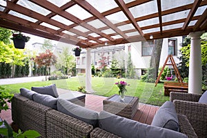 Modern arbour with garden furniture photo