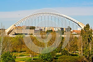 Modern arch-shaped bridge over the Guadiana river, MÃÂ©rida photo