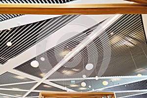 Modern Architectural Ceiling Design with Geometric Patterns and Pendant Lights